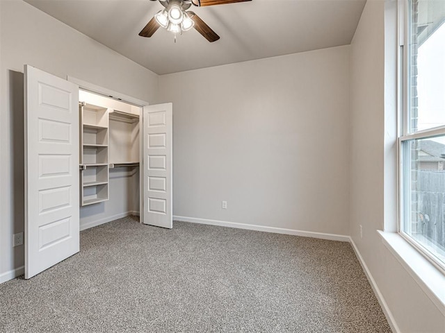 unfurnished bedroom featuring carpet floors, ceiling fan, and a closet