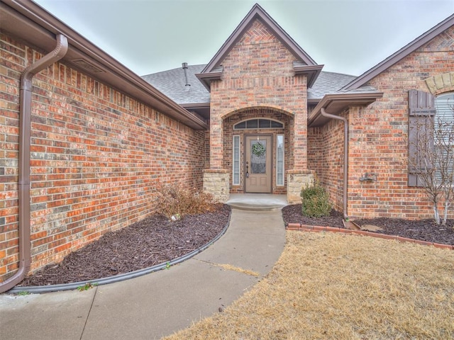 doorway to property featuring a yard