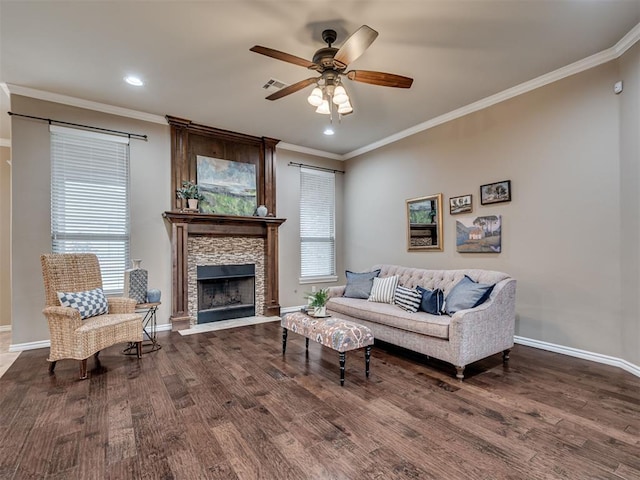 living room featuring crown molding, hardwood / wood-style flooring, and ceiling fan