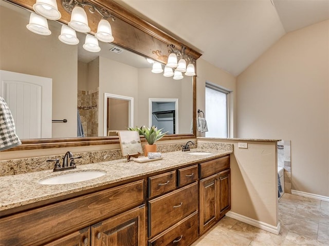 bathroom with vanity, plus walk in shower, and vaulted ceiling