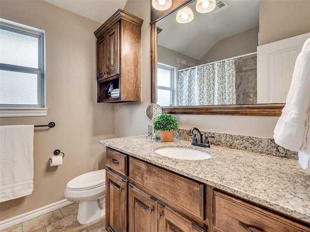 bathroom with lofted ceiling, tile patterned flooring, vanity, a shower with curtain, and toilet