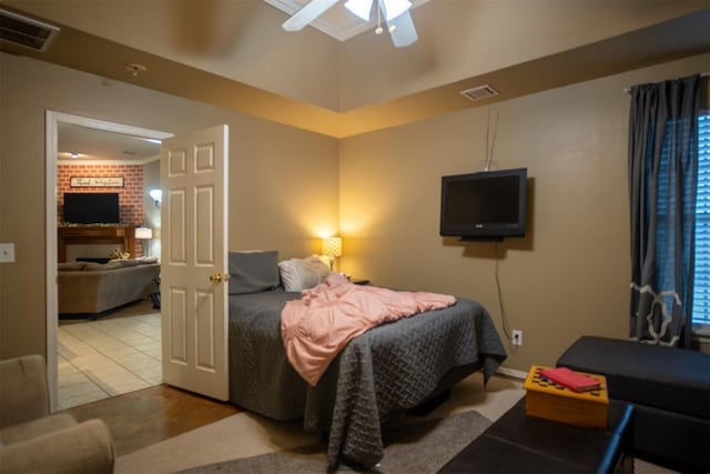 tiled bedroom with ceiling fan