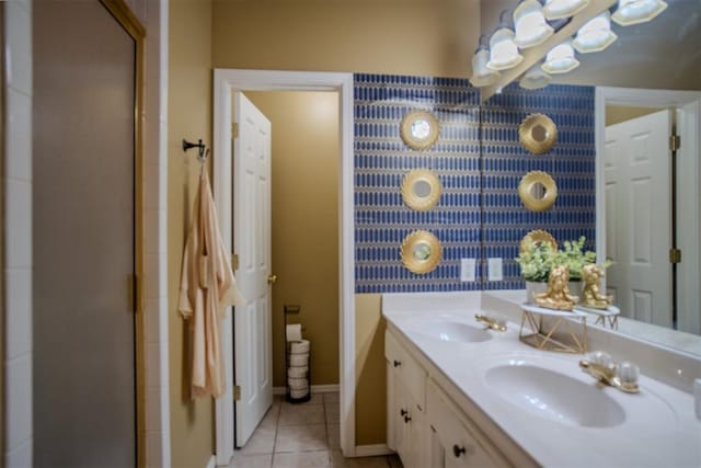 bathroom featuring tile patterned flooring, vanity, and an enclosed shower