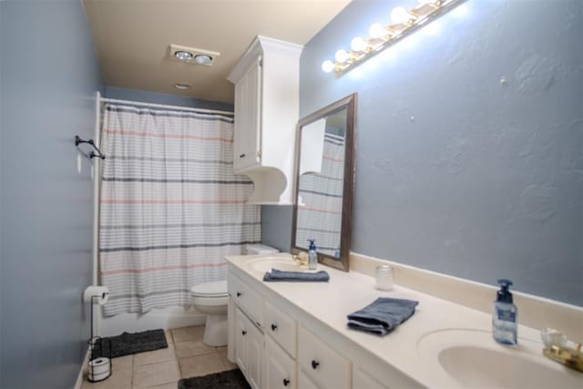 full bathroom featuring vanity, tile patterned floors, toilet, and shower / bathtub combination with curtain