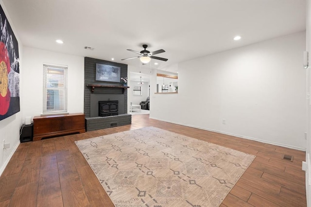 unfurnished living room featuring wood-type flooring and ceiling fan