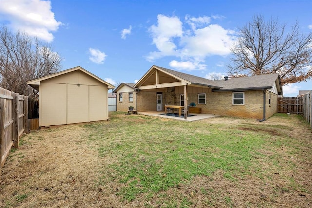 back of house with a yard and a patio area