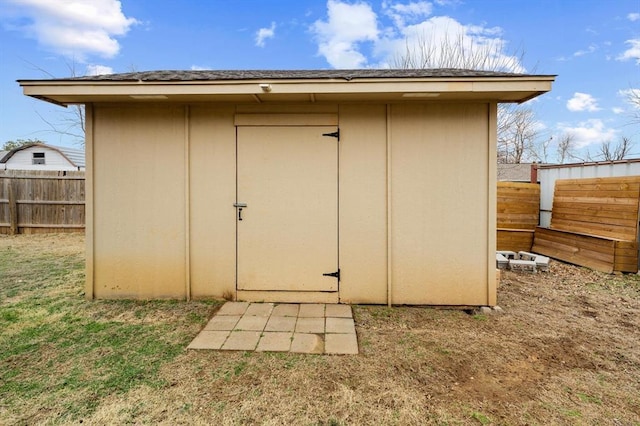 view of outbuilding featuring a yard