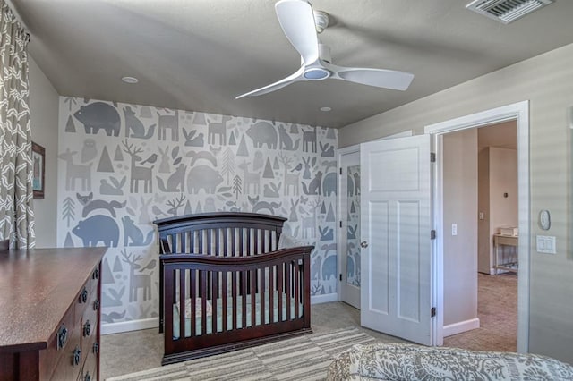 carpeted bedroom with ceiling fan