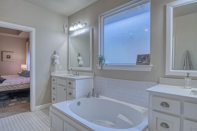 bathroom featuring vanity and a tub