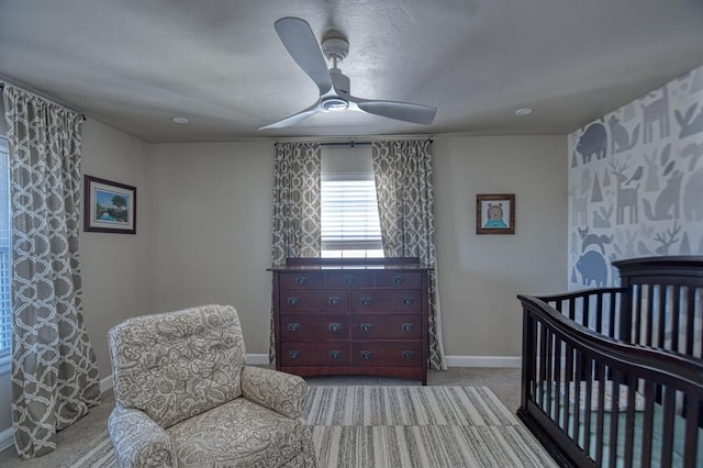 carpeted bedroom with ceiling fan