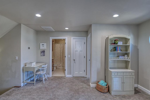 interior space featuring light colored carpet