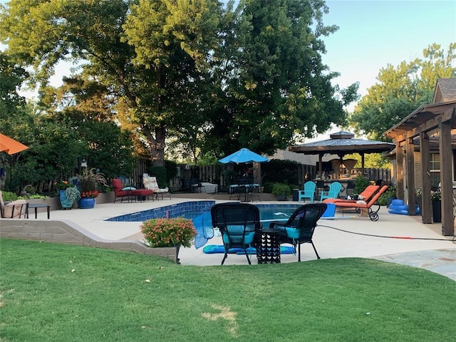 view of pool featuring a gazebo, a lawn, and a patio