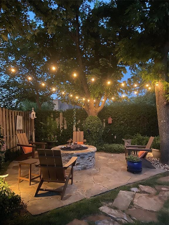 patio at night with an outdoor fire pit