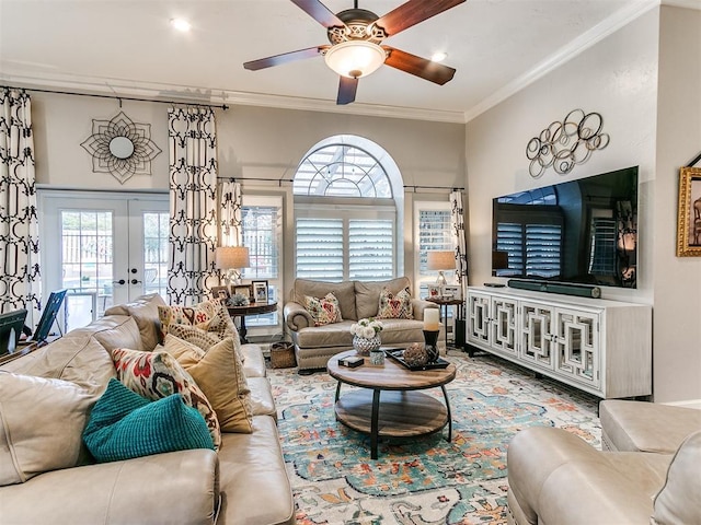 living room featuring crown molding, ceiling fan, and french doors