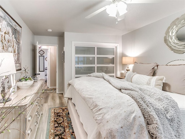 bedroom featuring hardwood / wood-style floors and ceiling fan