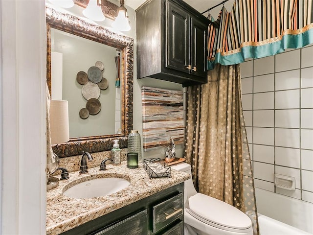 full bathroom featuring shower / tub combo, vanity, and toilet