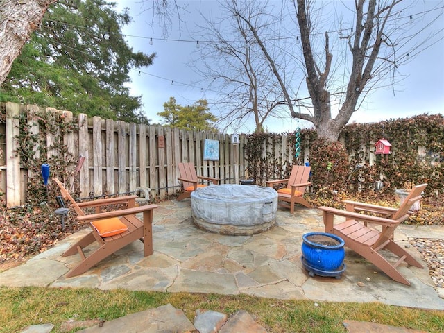 view of patio with a fire pit