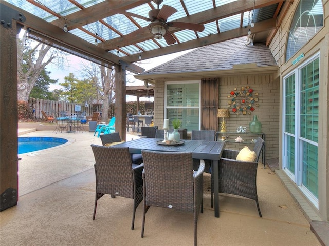 view of patio featuring a fenced in pool, a pergola, and ceiling fan