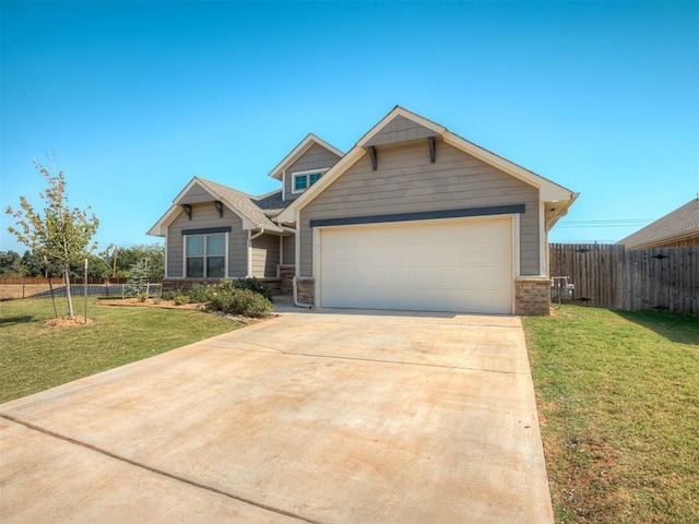 craftsman-style home featuring a garage and a front lawn