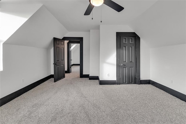 bonus room featuring ceiling fan, lofted ceiling, and carpet floors