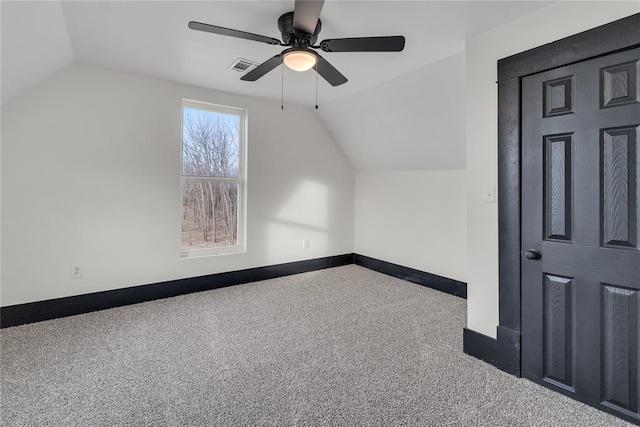 bonus room featuring vaulted ceiling, carpet, and ceiling fan