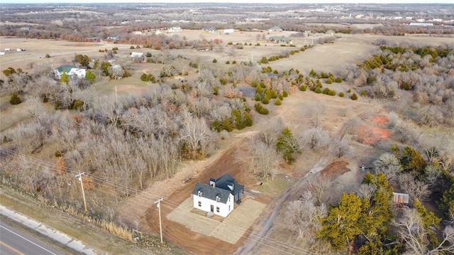 birds eye view of property with a rural view