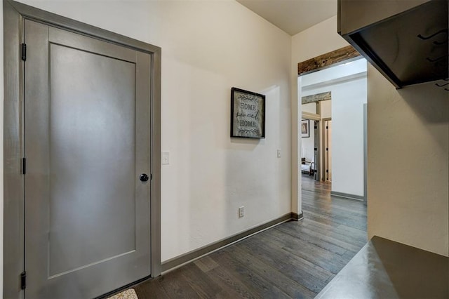 hallway with dark wood-type flooring