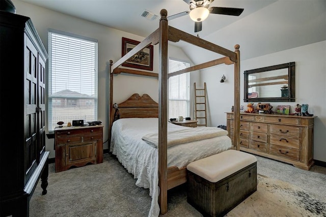 carpeted bedroom featuring vaulted ceiling and ceiling fan