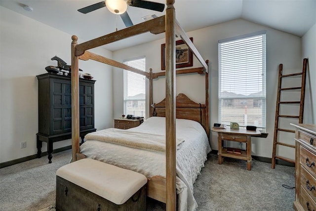 carpeted bedroom with ceiling fan and vaulted ceiling