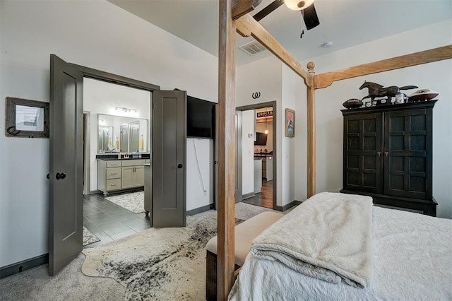 bedroom featuring connected bathroom and ceiling fan