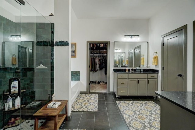 bathroom featuring vanity, separate shower and tub, and tile patterned floors