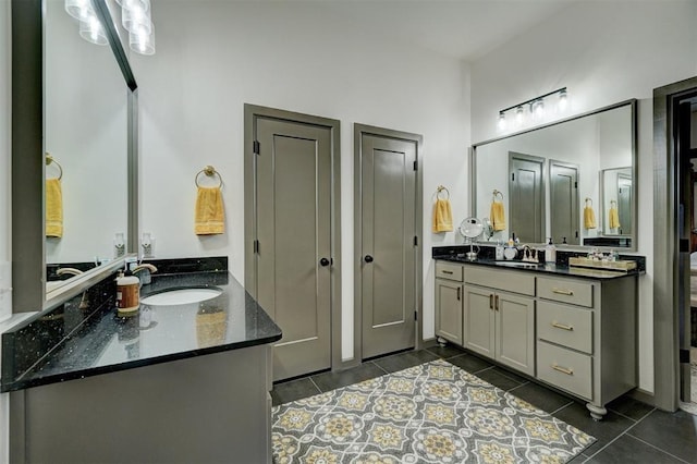 bathroom with tile patterned floors and vanity