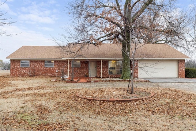 single story home featuring a garage