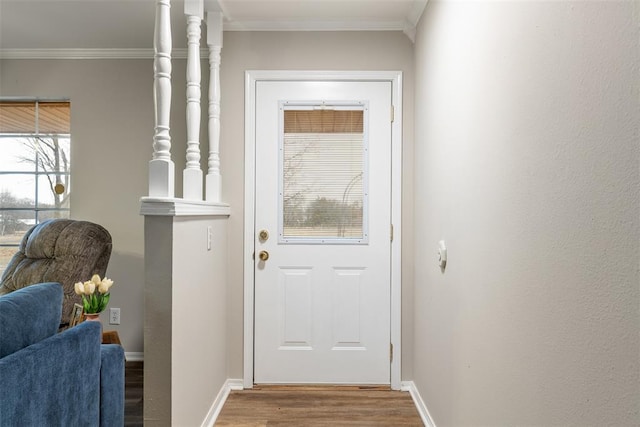 doorway featuring hardwood / wood-style flooring and ornamental molding