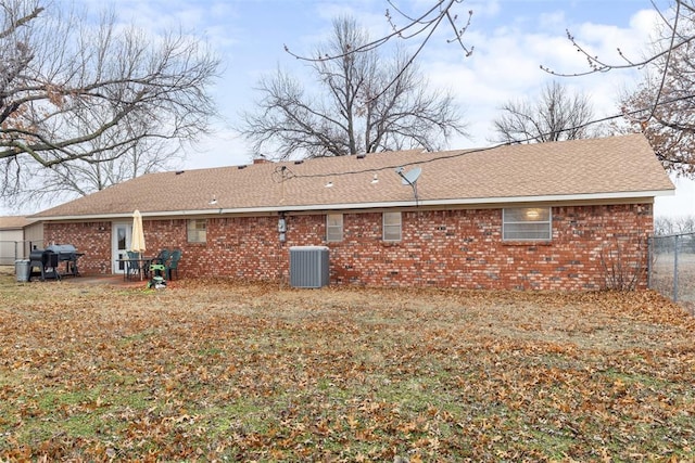 back of house featuring central AC and a patio area