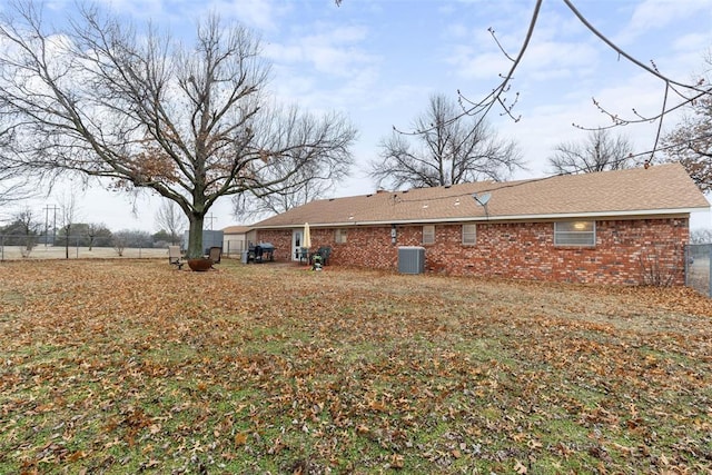 back of house featuring central AC