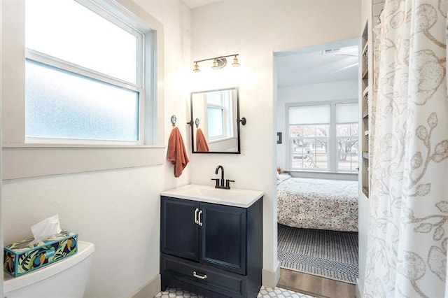 bathroom featuring vanity and toilet