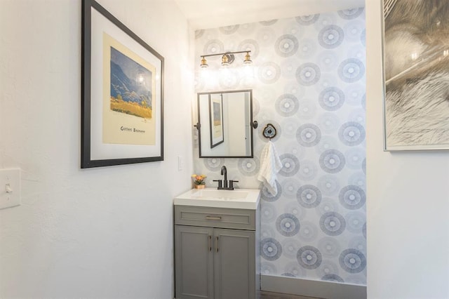 bathroom featuring vanity and a shower