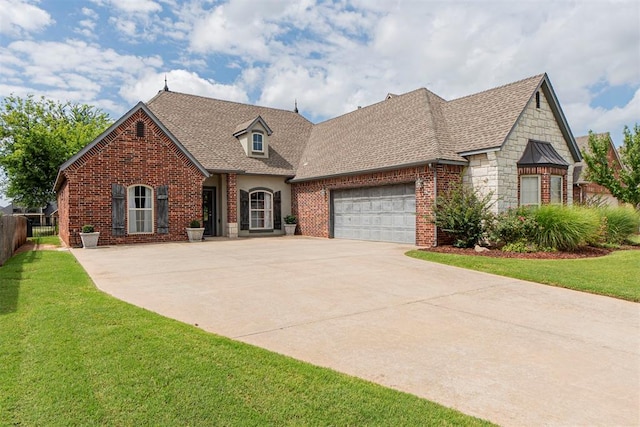 view of front facade with a garage and a front yard