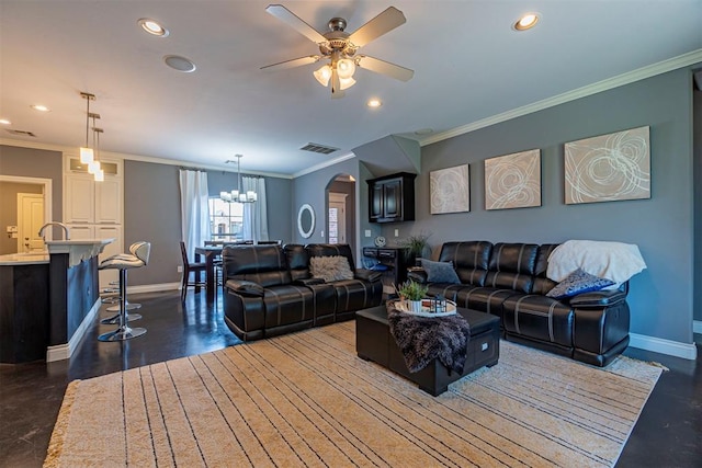 living room featuring ceiling fan with notable chandelier and ornamental molding