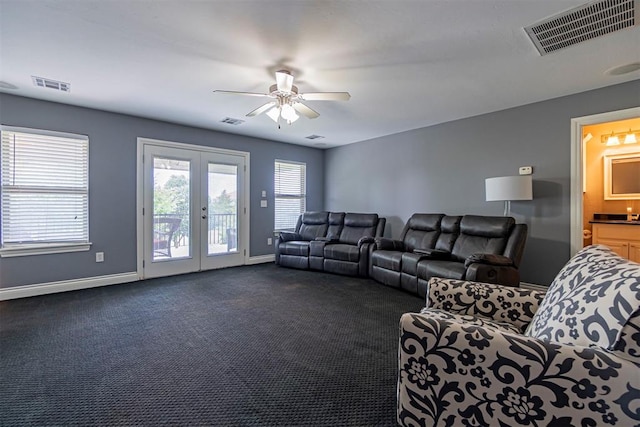 carpeted living room with ceiling fan and french doors