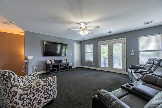 carpeted living room with ceiling fan and french doors