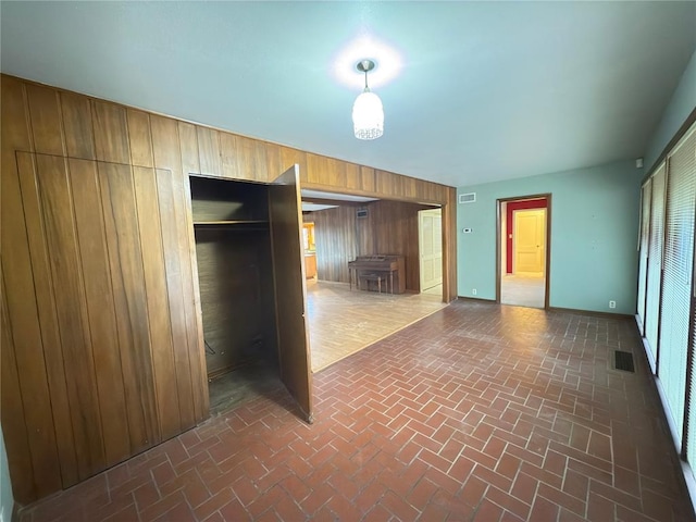 interior space featuring wood walls