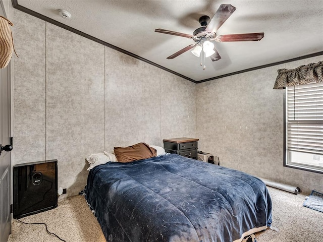bedroom with light carpet, ornamental molding, a textured ceiling, and a ceiling fan