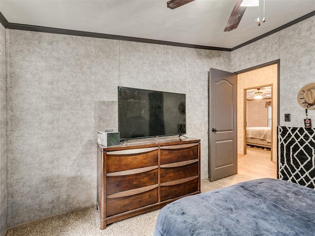 bedroom featuring a ceiling fan and crown molding