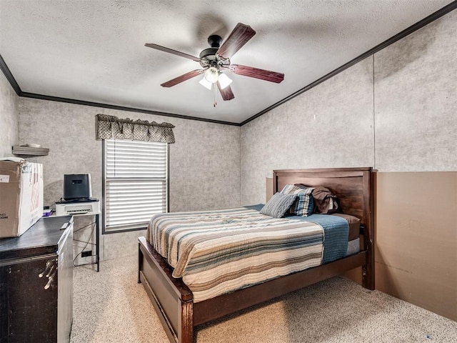 bedroom featuring a textured ceiling, ornamental molding, and a ceiling fan