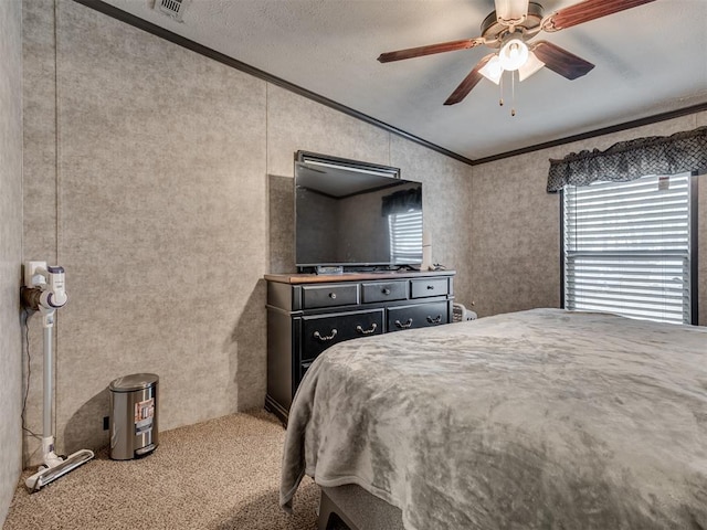 bedroom featuring visible vents, a ceiling fan, lofted ceiling, ornamental molding, and carpet