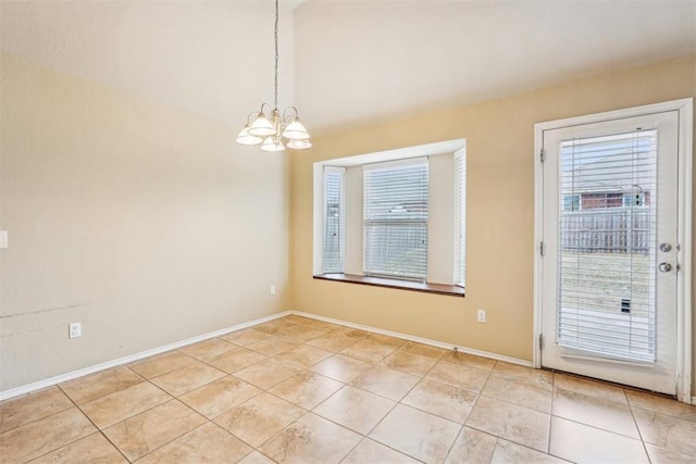 unfurnished dining area with light tile patterned floors and an inviting chandelier