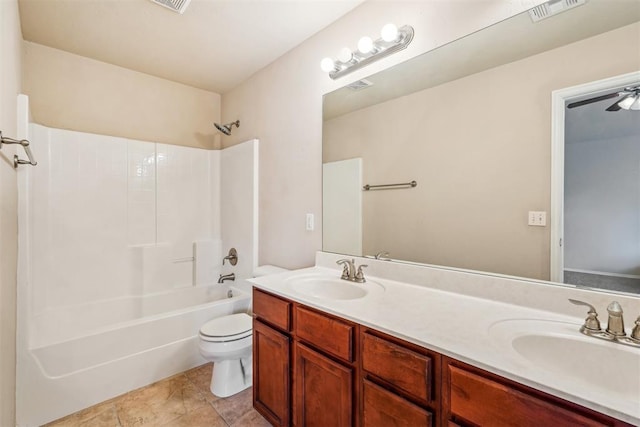 full bathroom with shower / tub combination, vanity, tile patterned floors, and toilet