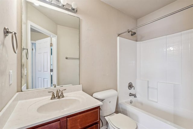 full bathroom with vanity, bathtub / shower combination, and toilet